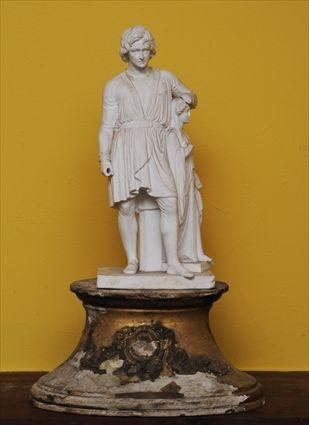 Appraisal: PARIANWARE FIGURE OF A SCULPTOR Modeled wearing belted tunic with