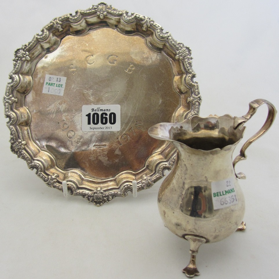 Appraisal: A silver waiter of shaped circular form with a decorated