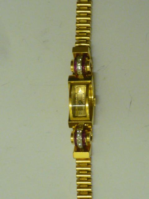 Appraisal: A LADY'S 'S RUBY AND DIAMOND COCKTAIL WATCH the winding