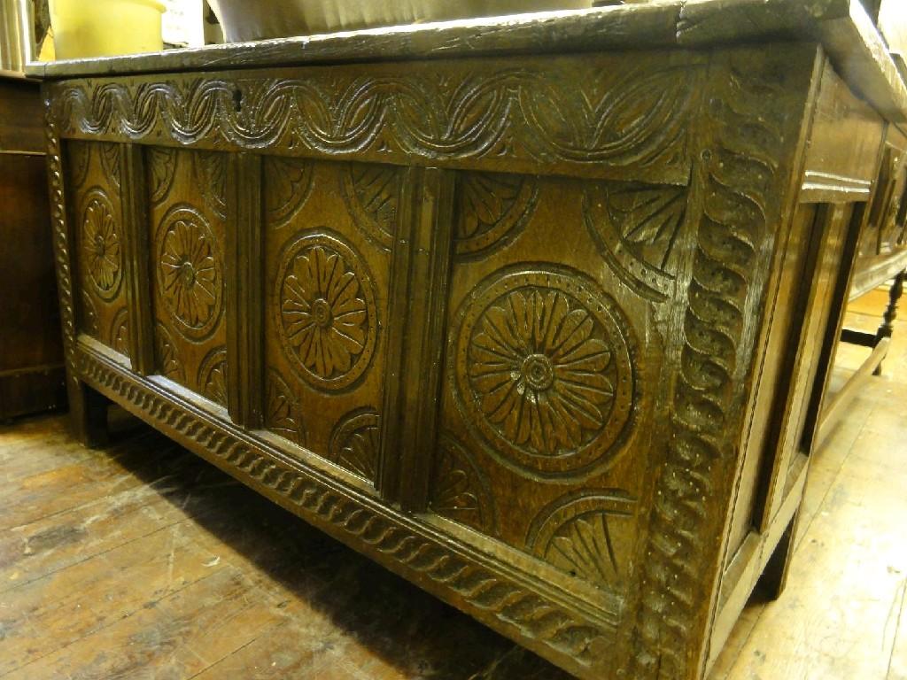 Appraisal: An th century oak coffer the front elevation with carved