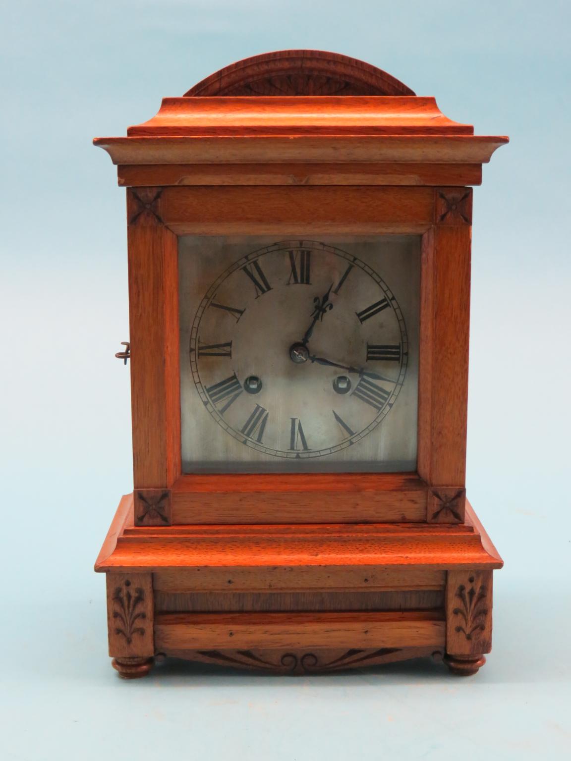 Appraisal: A Victorian light oak mantel clock with square silvered dial