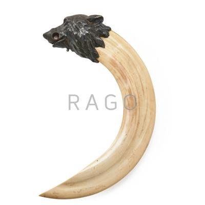 Appraisal: IVORY TUSK AND SILVER CIGAR CUTTER Bear head form with