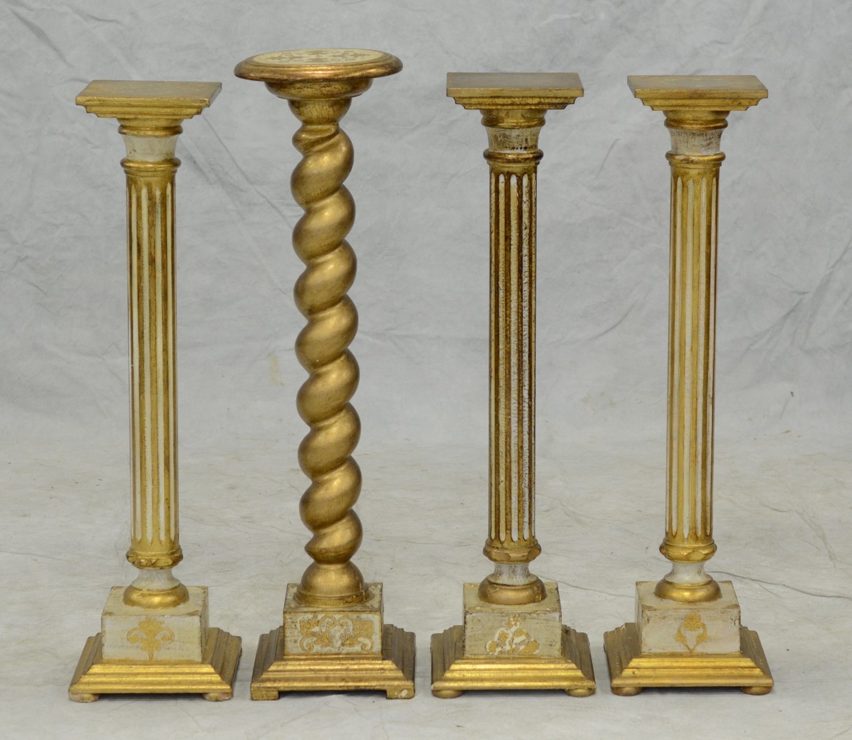 Appraisal: Gilt and cream fluted display pedestals - square h with