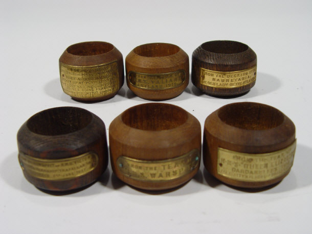 Appraisal: Six teak commemorative napkin rings produced from famous ships including