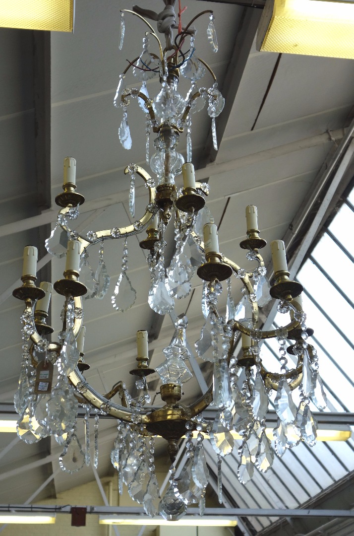 Appraisal: A pair of French brass and glass lustre chandeliers late