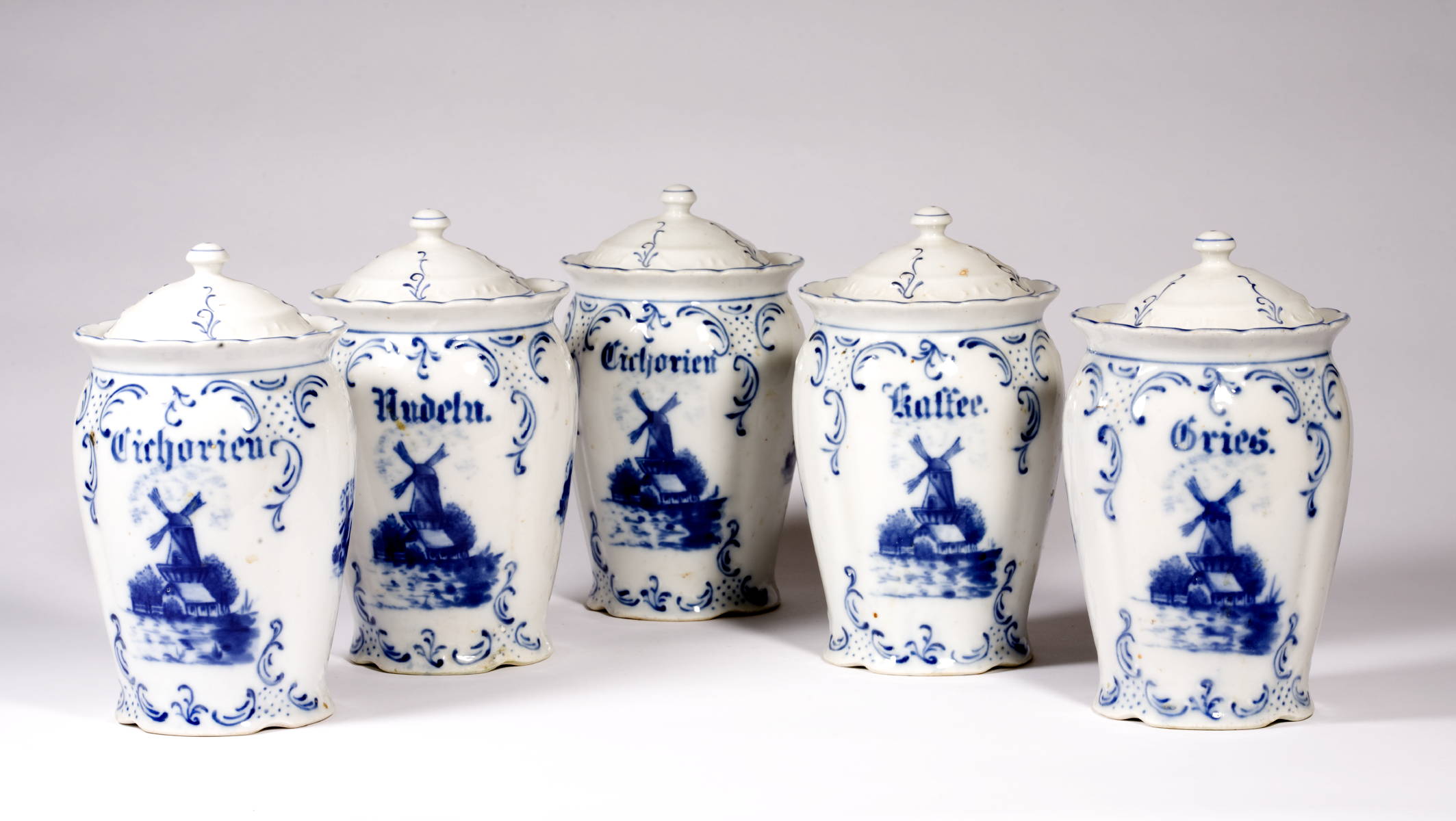 Appraisal: FIVE DELFT DESIGN PANTRY JARS WITH BLUE WIND MILL DECORATION