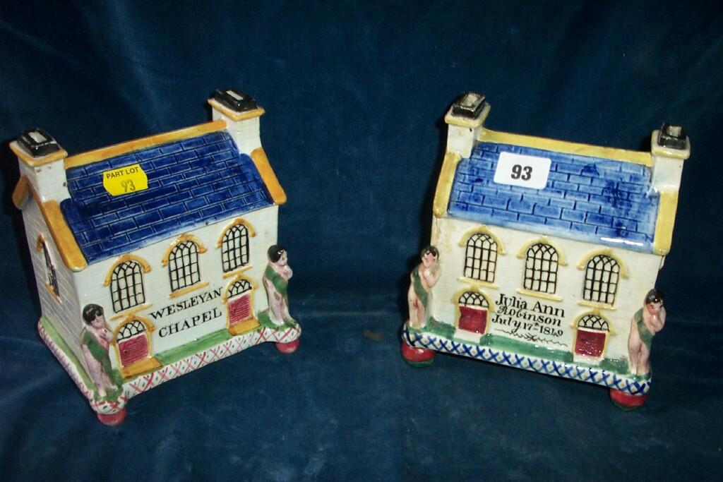 Appraisal: Two similar th century Staffordshire pottery money boxes in the