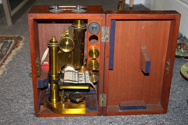 Appraisal: AN R J BECK BRASS MICROSCOPE with various lenses in