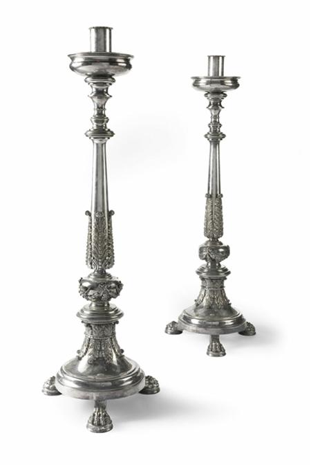 Appraisal: A pair of electroplated altar candlesticks the turned stems with