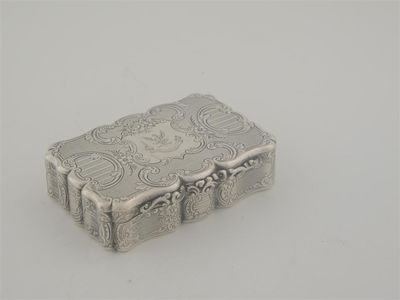 Appraisal: A Victorian snuff box of serpentine outline with reserves of