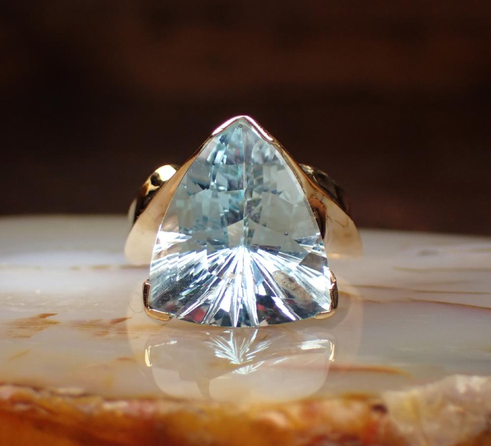 Appraisal: BLUE TOPAZ AND FOURTEEN KARAT GOLD RING having a single