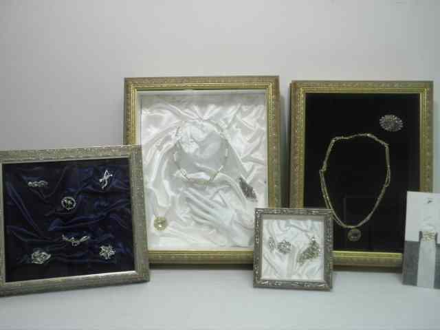 Appraisal: Lot of assorted costume jewelry displayed in four different shadow