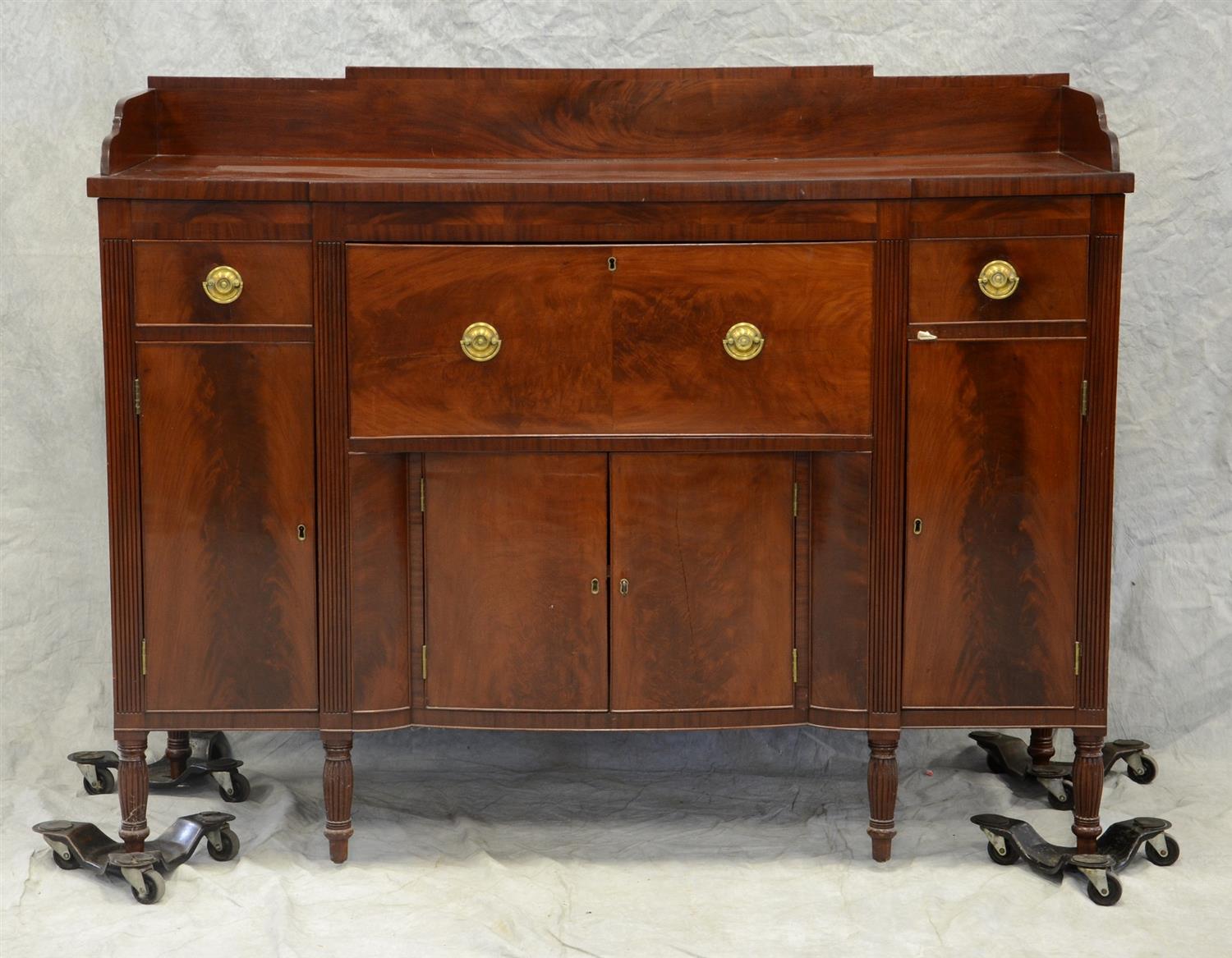 Appraisal: Mahogany Sheraton sideboard dovetailed gallery base with center deep drawer