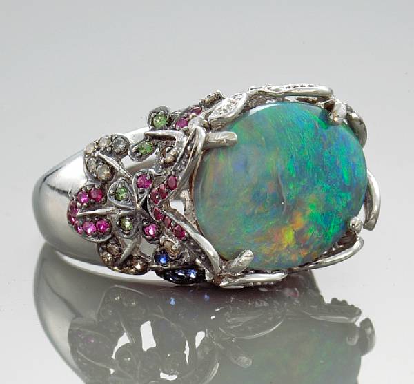 Appraisal: An opal sapphire diamond and colored diamond ring centering an