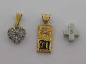 Appraisal: Three small gold and diamond set pendants two marked as