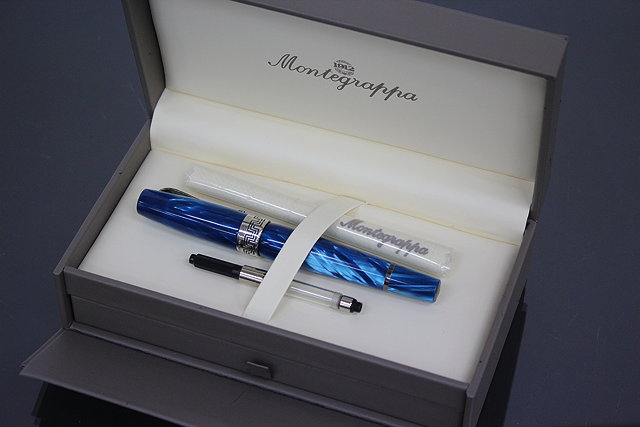 Appraisal: A MONTEGRAPPA FOUNTAIN PEN in turquoise blue celluloid with white