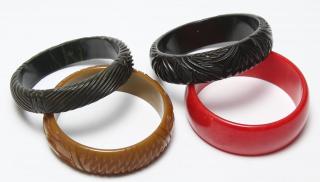 Appraisal: High Relief Bakelite Bracelets Comprising red black and olive tone