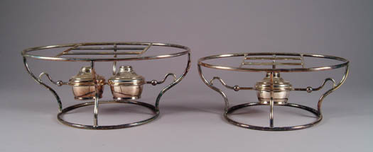 Appraisal: TWO SILVER PLATED FOOD WARMING FRAMES The first with two