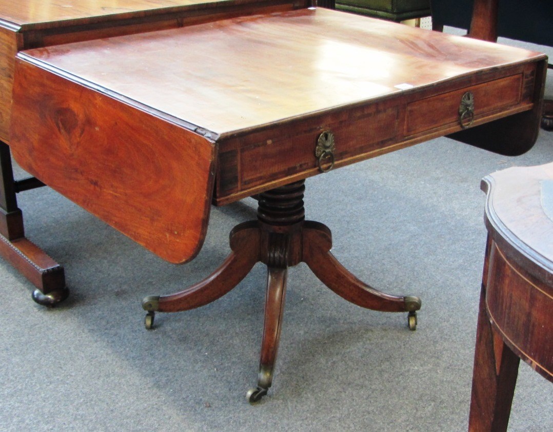 Appraisal: A Regency mahogany sofa table on turned column and four