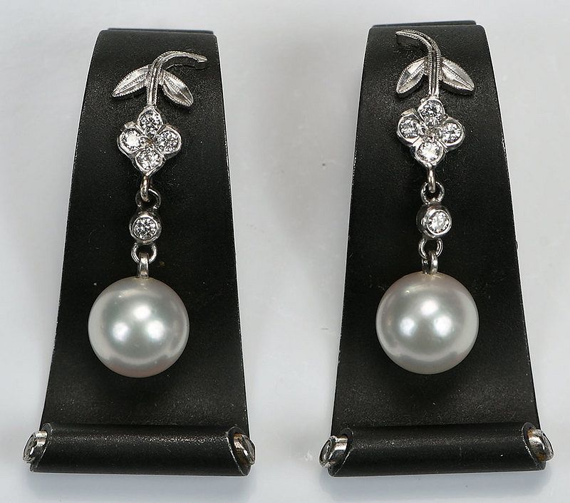 Appraisal: Palladium Steel Pearl and Diamond Earclips each with one pearl