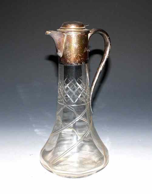 Appraisal: A SILVER MOUNTED CUT GLASS CLARET JUG silver mount with