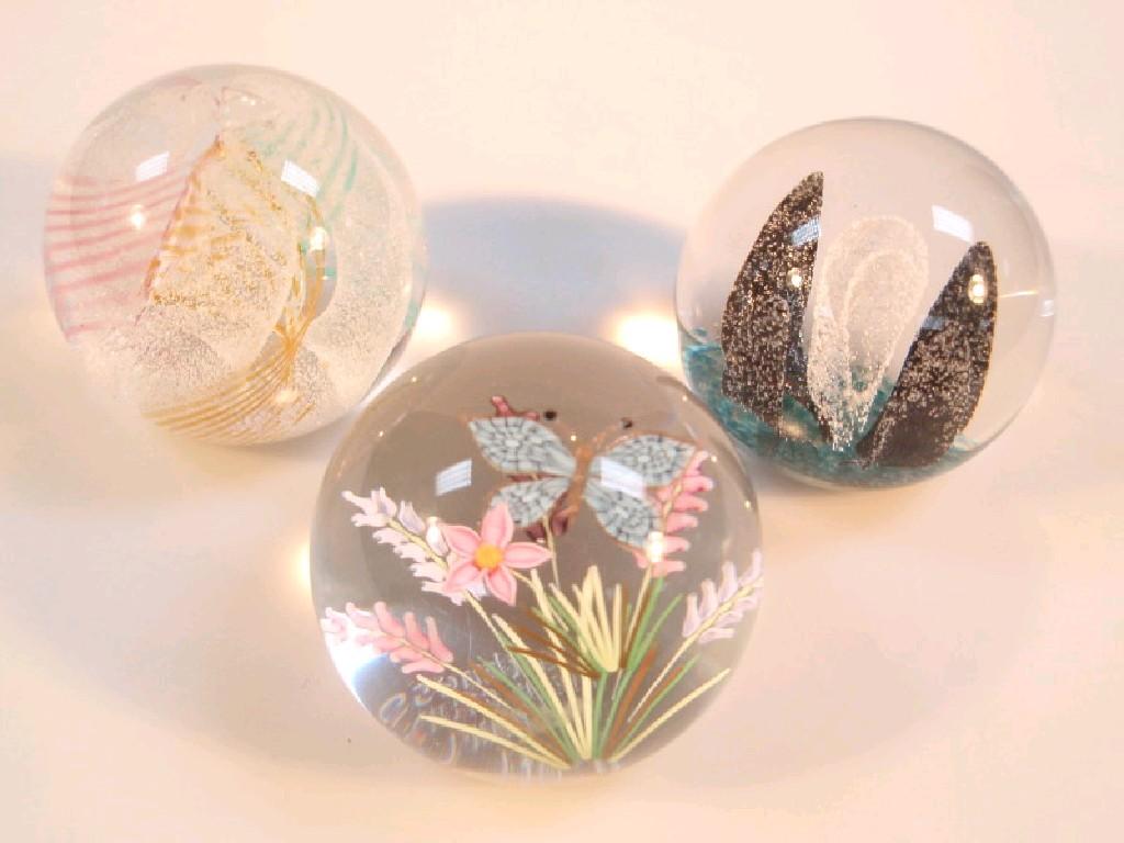 Appraisal: Three Caithness glass paperweights 'Daydreams' 'Field Study Butterfly' and 'Midnight'