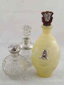 Appraisal: A hallmarked silver mounted cut glass perfume bottle Birmingham another