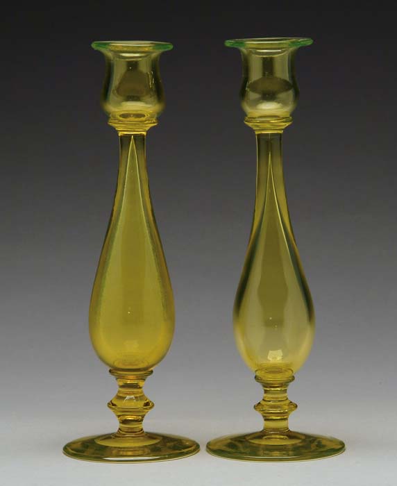 Appraisal: PAIR OF STEUBEN BRISTOL YELLOW CANDLESTICKS Hollow-blown stem with applied