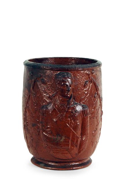 Appraisal: A stoneware jar English circa moulded with a bust of