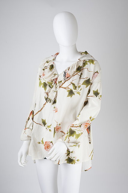 Appraisal: An Alexander McQueen cotton cream blouse decorated with birds of