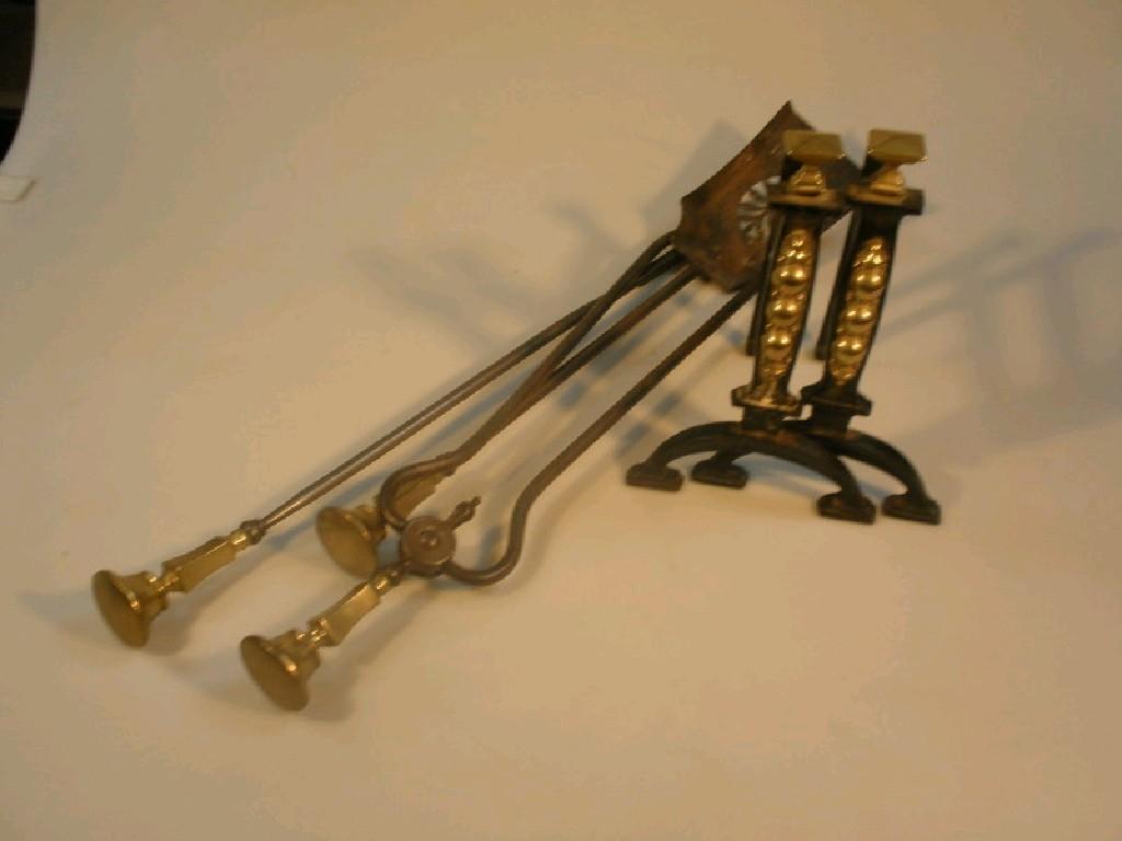 Appraisal: Victorian polished steel fire irons with brass knops and a