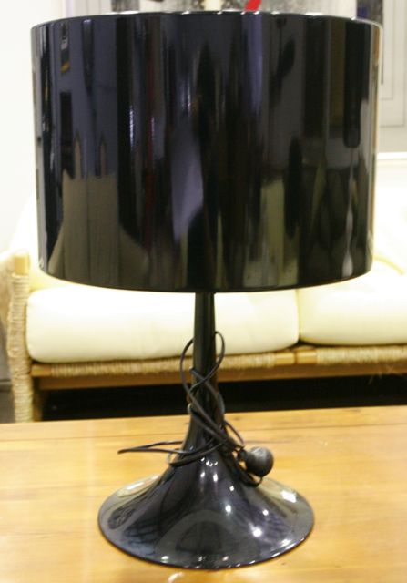 Appraisal: A black enamelled metal contemporary table lamp