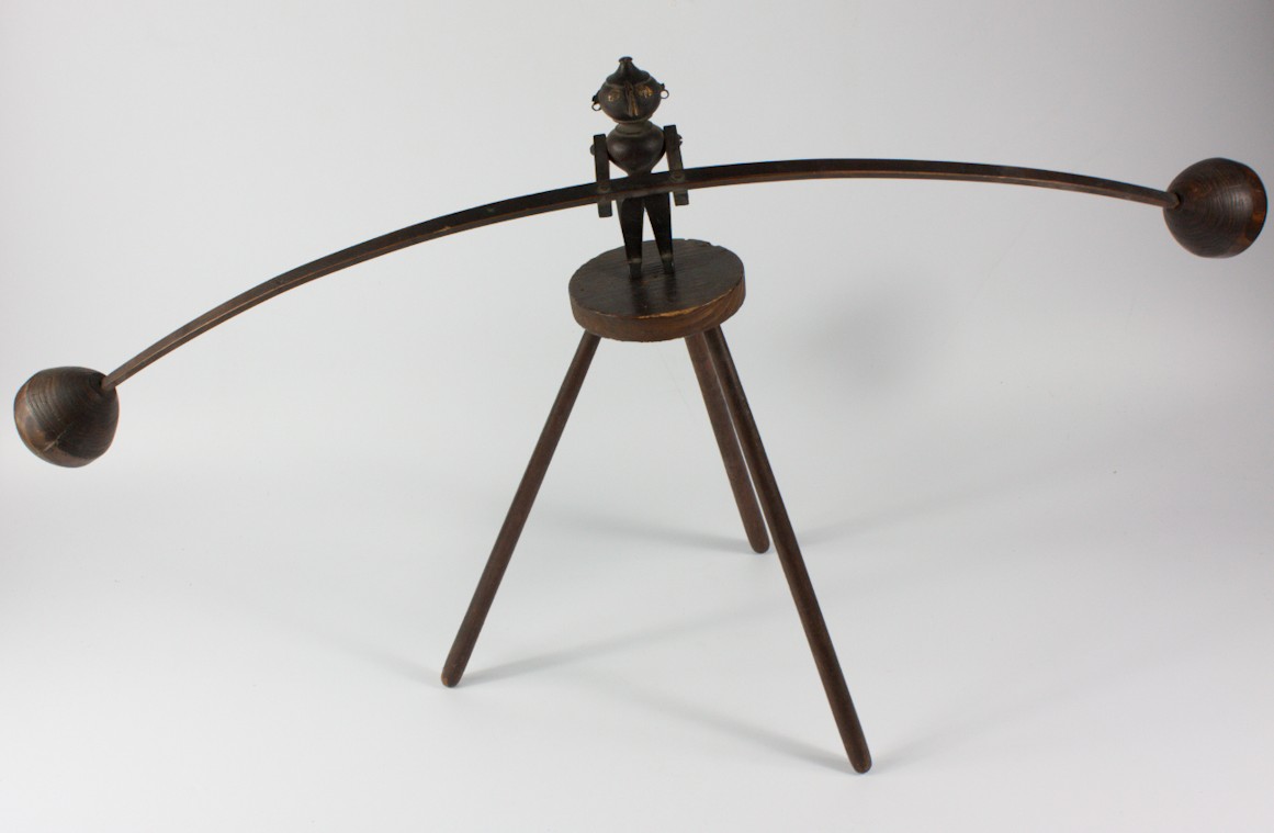 Appraisal: An early thC novelty turned wooden balancing figure and a