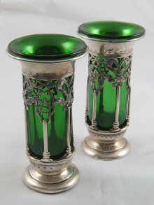 Appraisal: A pair of pierced and finely chased silver spill vases