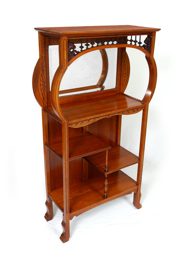 Appraisal: AESTHETIC MOVEMENT CARVED WALNUT ETAGERE Top inner gallery with carved