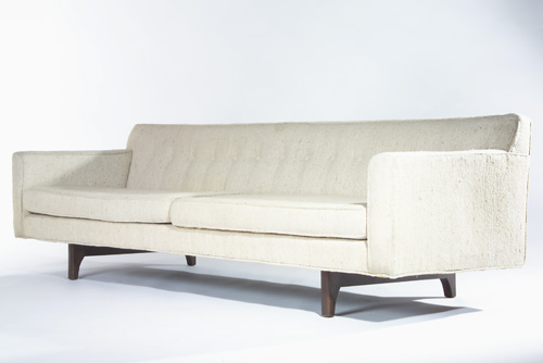 Appraisal: EDWARD WORMLEY DUNBAR Floating sofa with oatmeal-colored boucle upholstery on