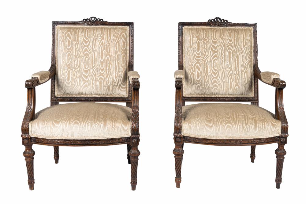 Appraisal: PAIR OF LOUIS XVI STYLE CARVED WALNUT FAUTEUILSeach covered in