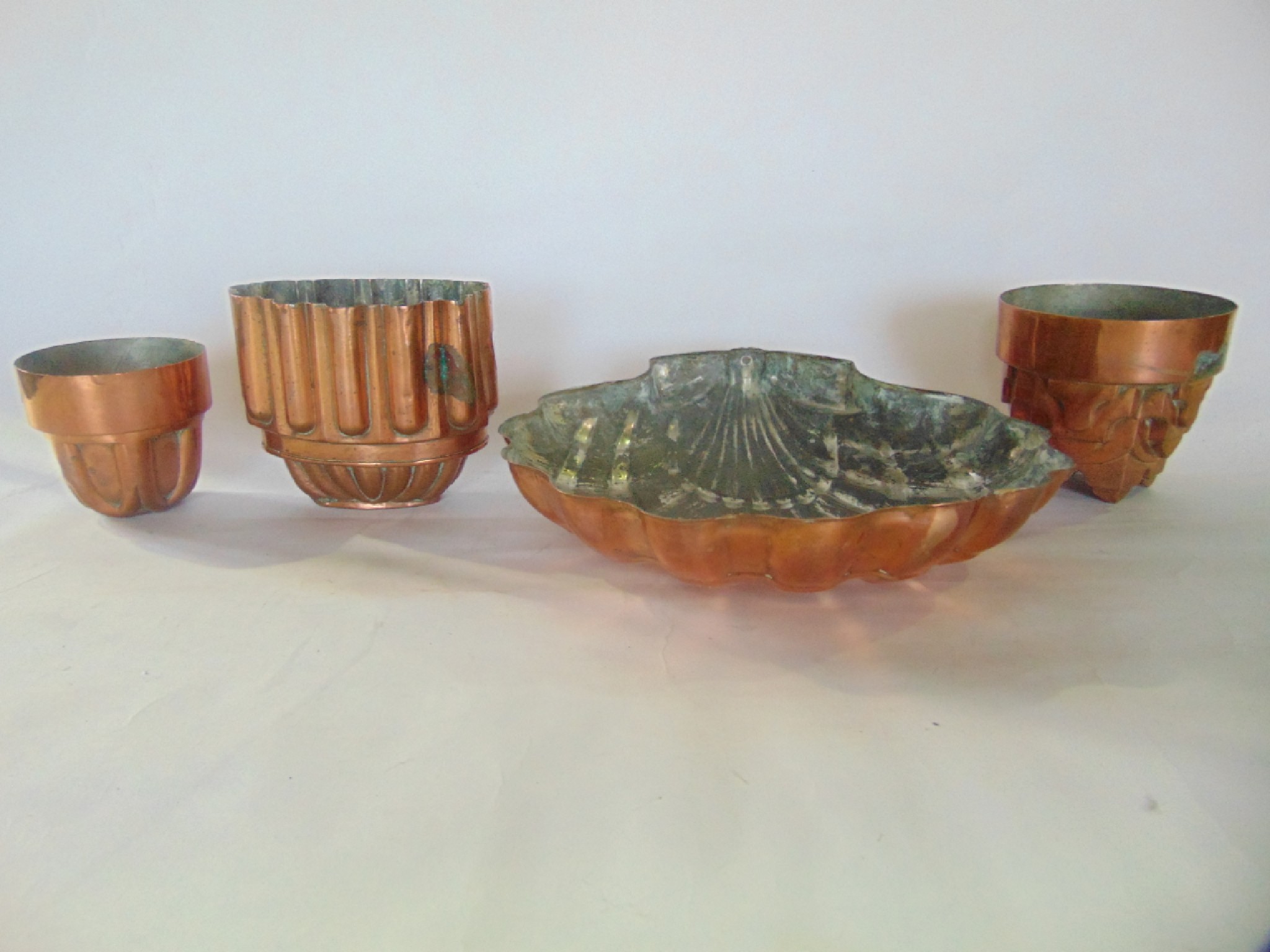 Appraisal: A trio of various th century lined copper jelly moulds