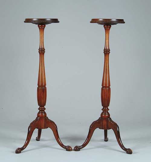 Appraisal: PAIR OF MAHOGANY TORCHERES Round dish top supported by a