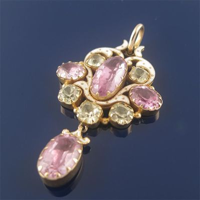 Appraisal: An Edwardian gold pendant set with three foiled back pink