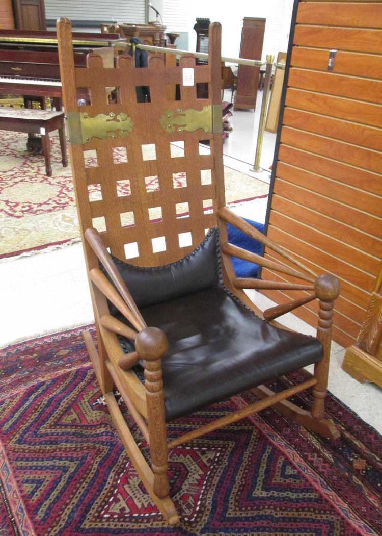 Appraisal: AN UNUSUAL OAK ROCKING CHAIR design attributed to George Jakob