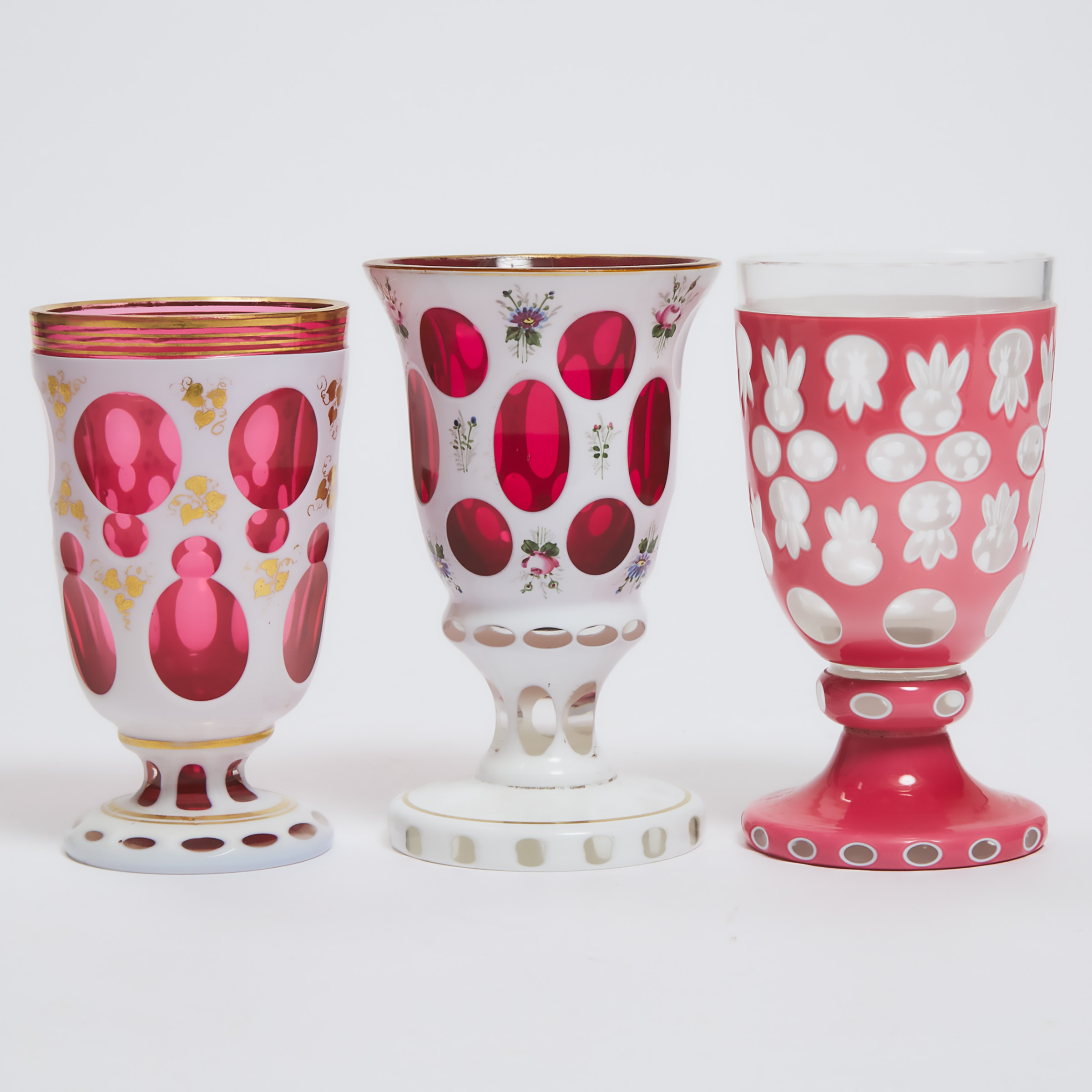 Appraisal: Three Bohemian Overlaid Cut Enameled and Gilt Glass Goblets second