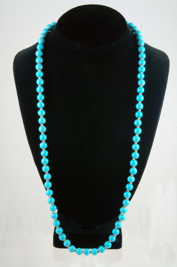 Appraisal: Turquoise bead necklace with marked K yellow filigree clasp and