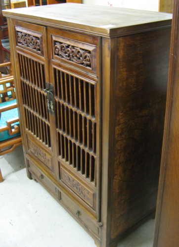 Appraisal: MING STYLE STORAGE CABINET Chinese th century with single wood