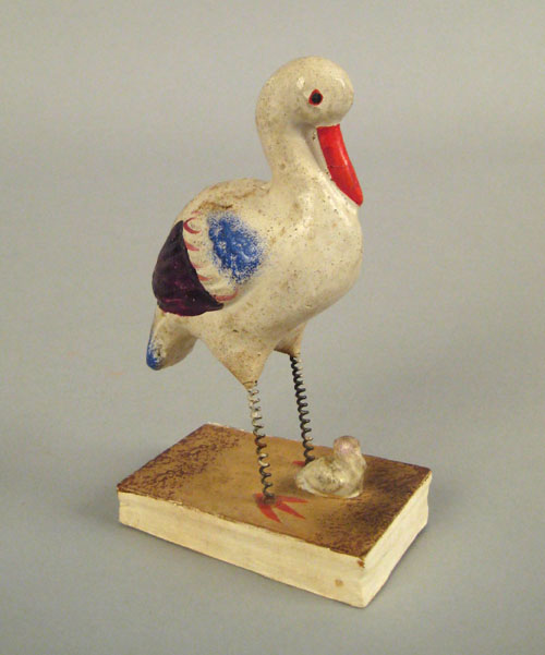 Appraisal: Polychrome decorated stork and young squeak toy late th c