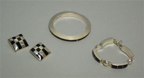 Appraisal: GROUP OF SILVER AND ONYX JEWELRY Comprising a slim bangle