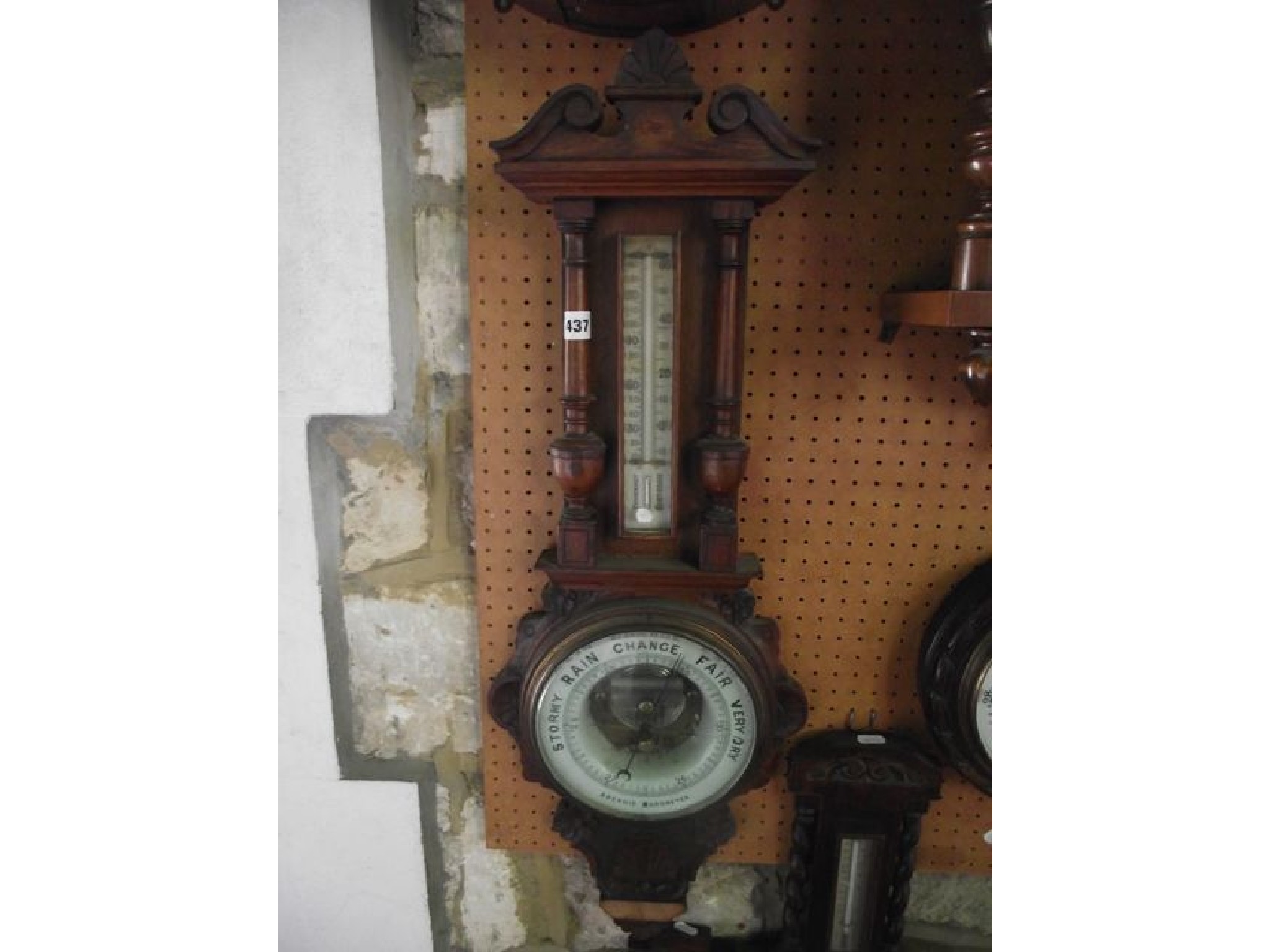 Appraisal: An Edwardian oak barometer the case with turned column supports