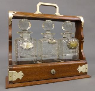 Appraisal: Decanter set Oak case decanter set with three cut glass