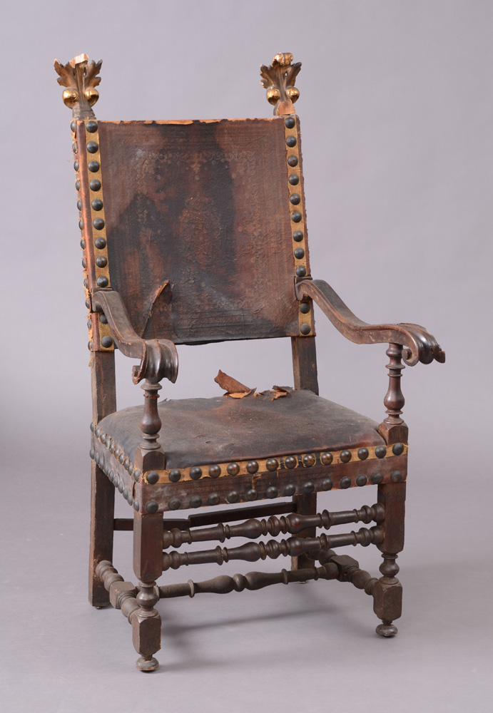 Appraisal: SPANISH BAROQUE WALNUT AND PARCEL-GILT TALL BACK ARMCHAIR The backrest