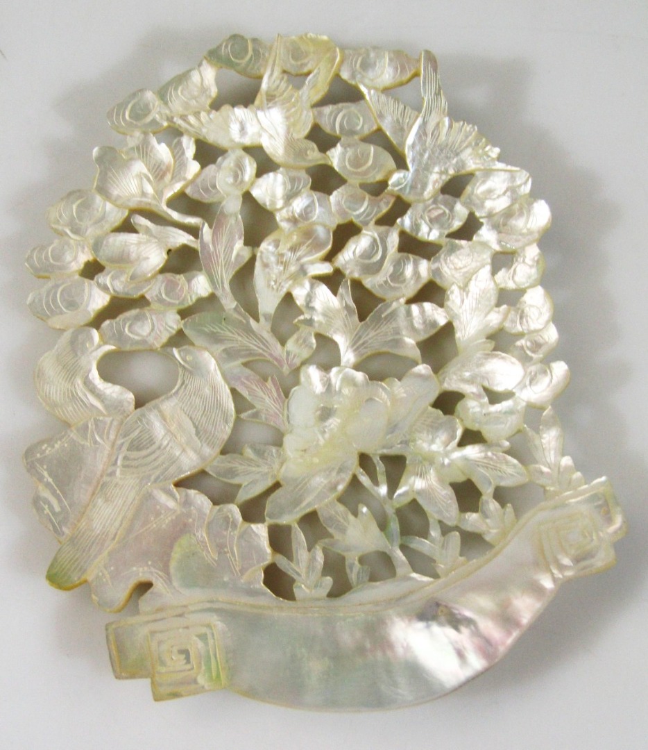 Appraisal: A thC pierced mother-of-pearl nacre style panel formed as birds